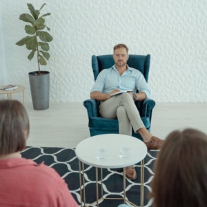 Addiction coach teaching coping strategies and relapse prevention