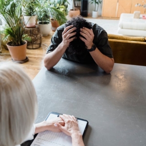 Mental health coach guiding client through stress management session
