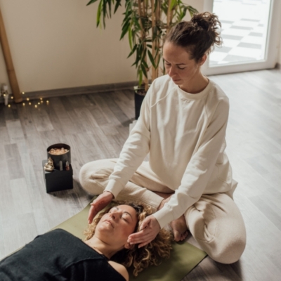 Person feeling relaxed and restored after an energy healing session, representing benefits of energy healing