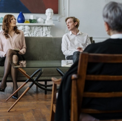 A relationship coach working with a couple on communication skills